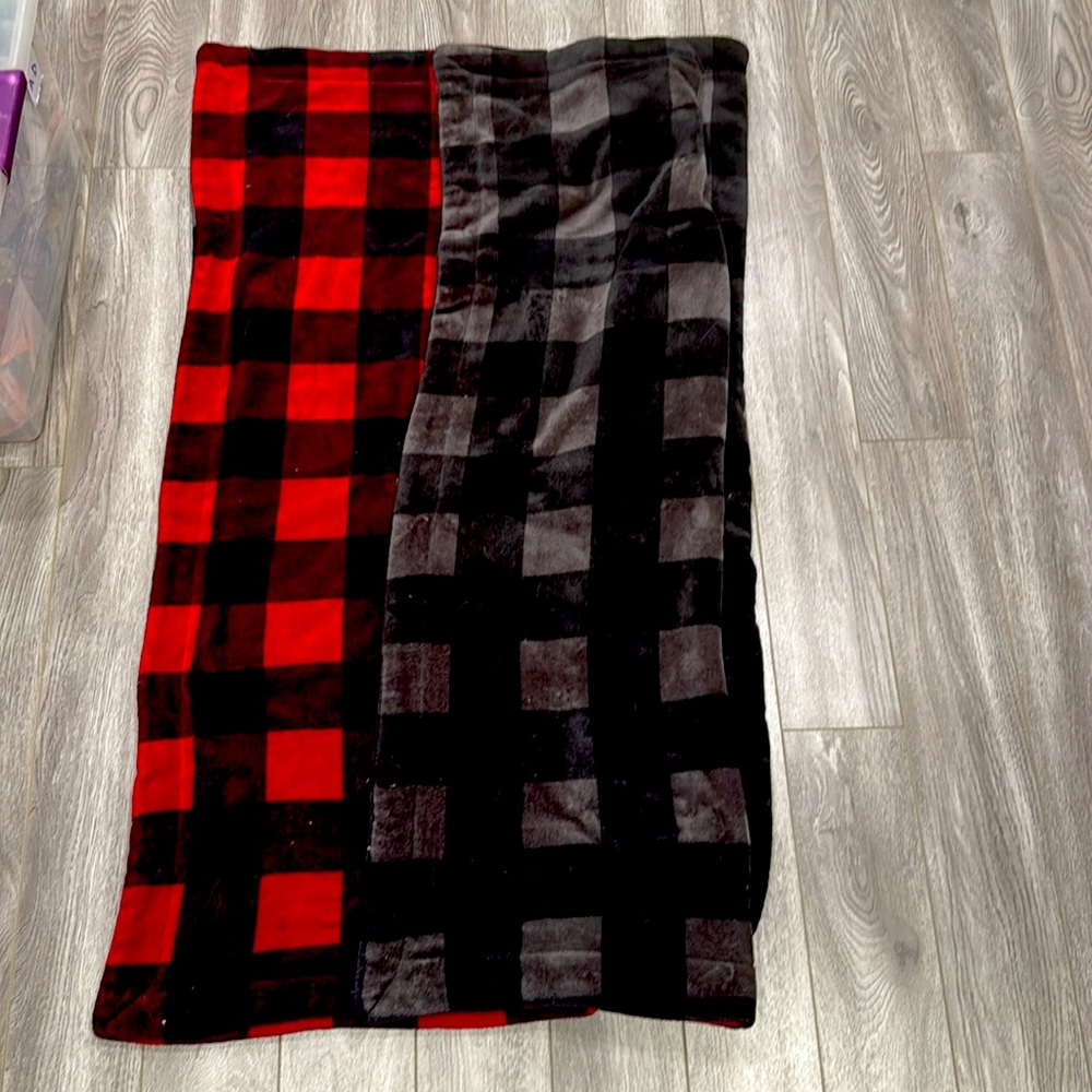 Red and black reversible square throw blanket